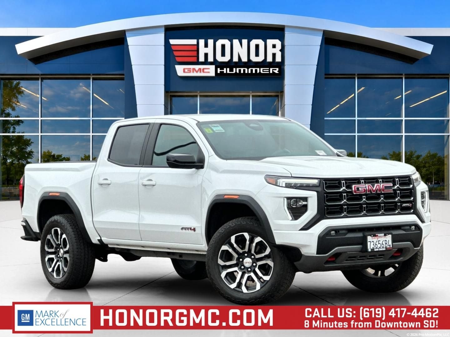 2024 GMC Canyon AT4 in Summit White — front three-quarter view