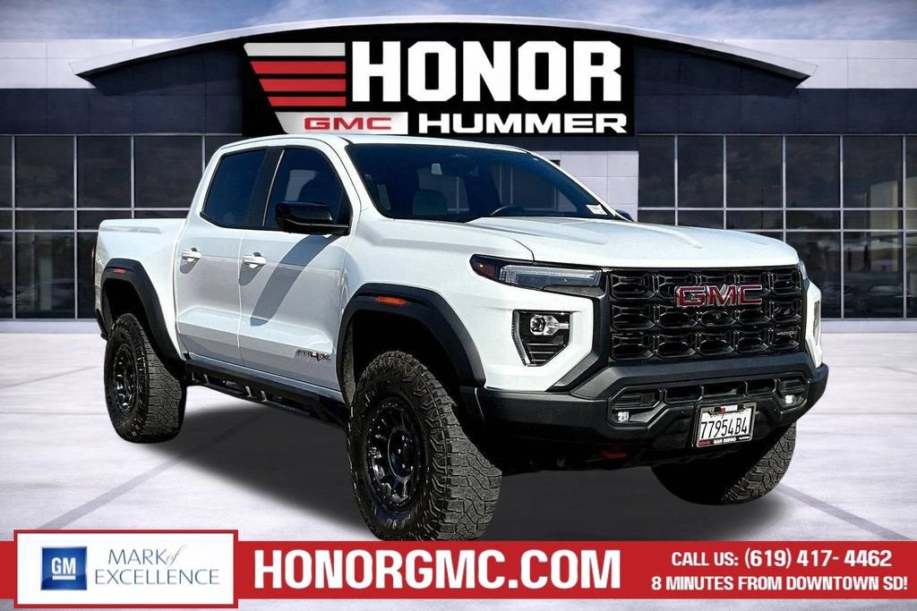 2024 GMC Canyon AT4X in Summit White — front three-quarter view