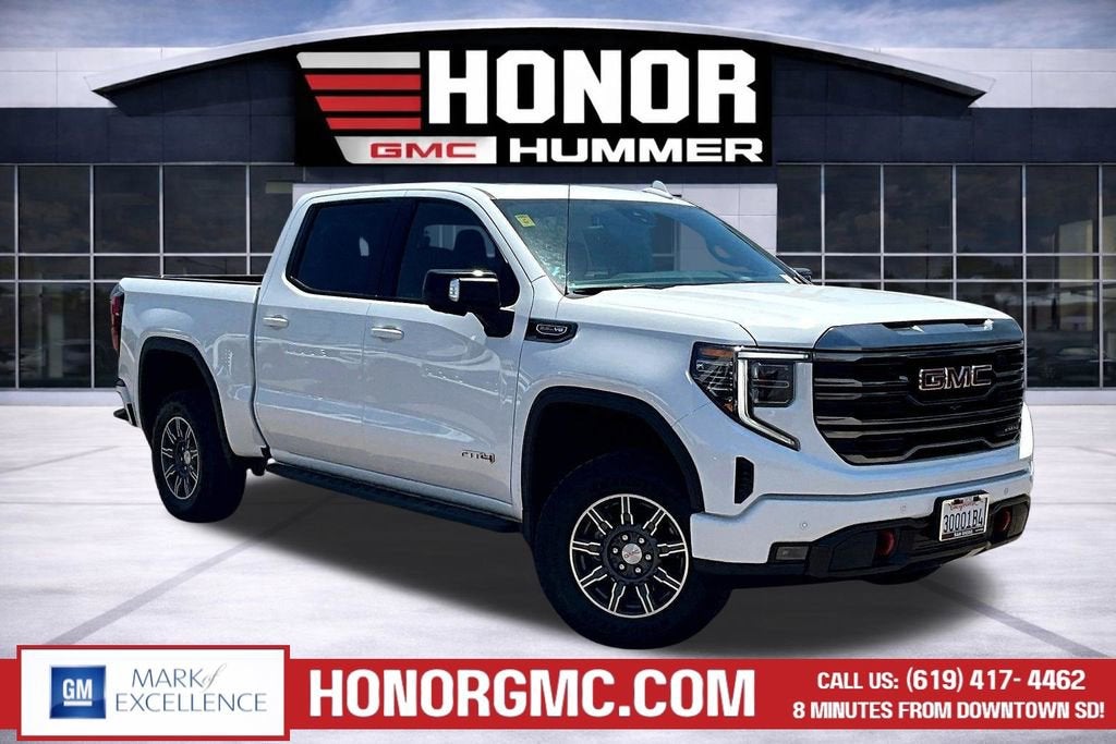 2024 GMC Sierra 1500 AT4 in Summit White — front three-quarter view