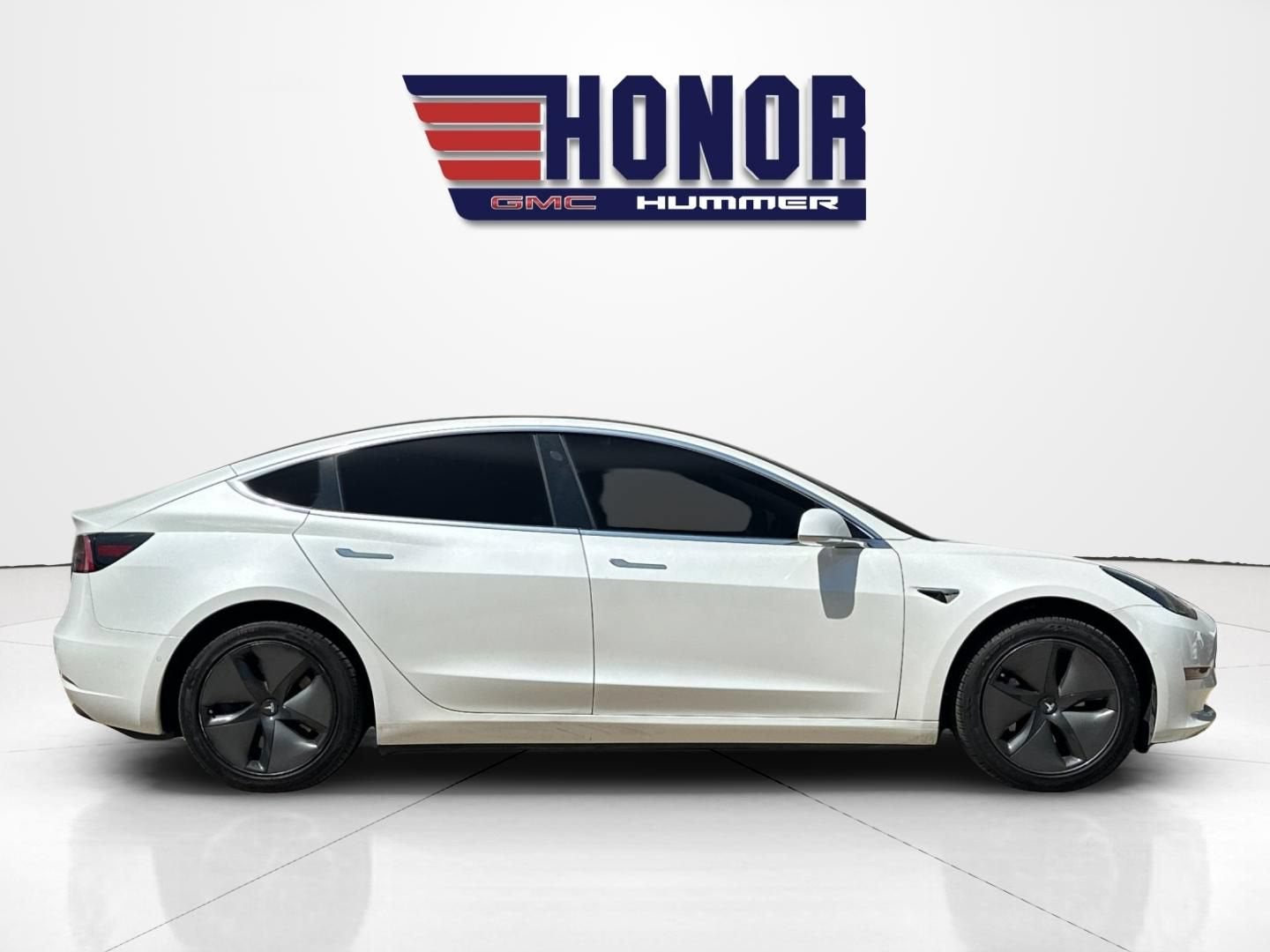 2019 Tesla Model 3 — rear three-quarter view